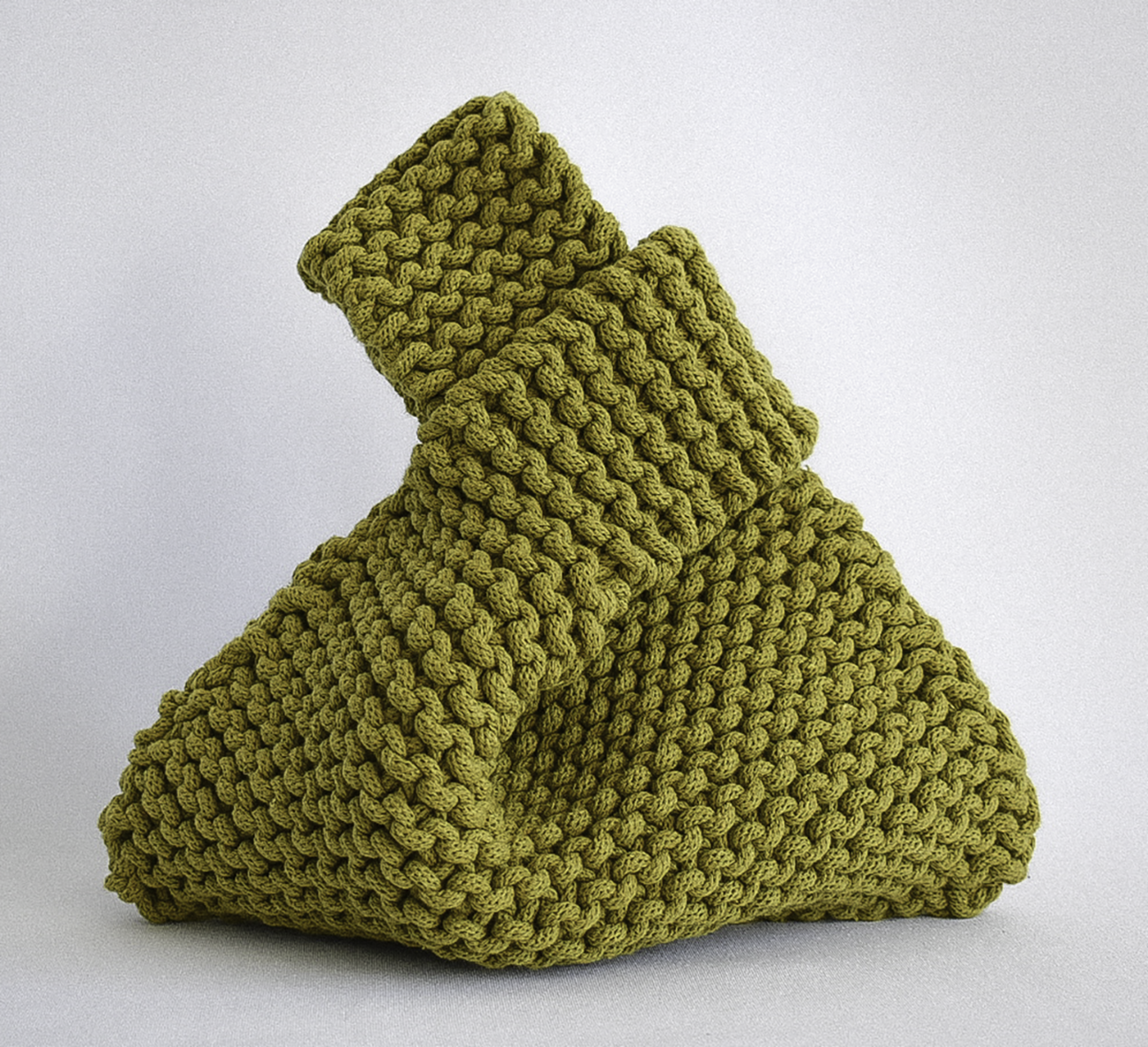 hand knitted knot bag, made with 100% recycled cotton textiles