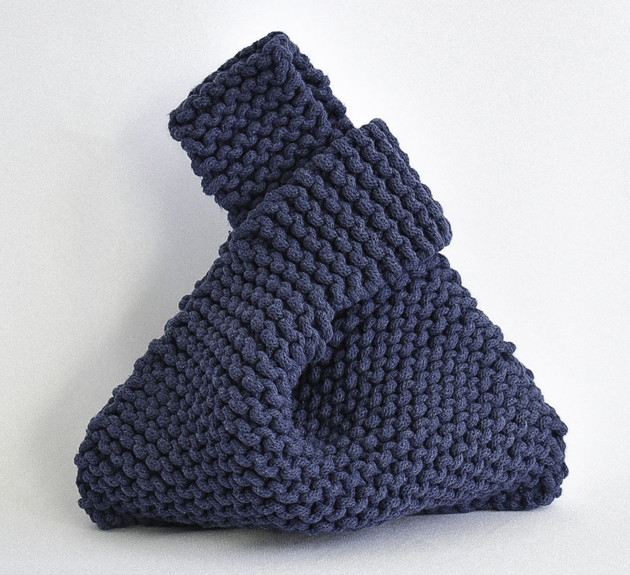 hand knitted knot bag, made with 100% recycled cotton textiles