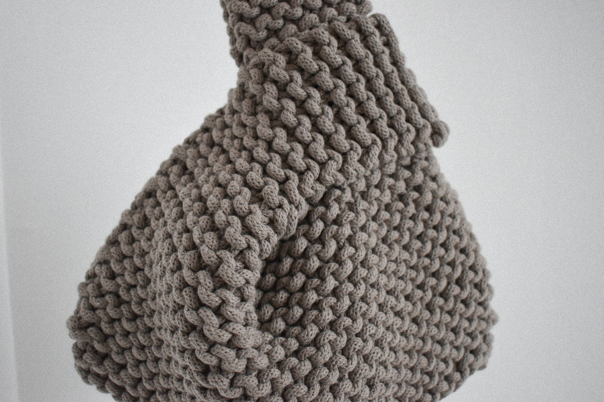 hand knitted knot bag, made with 100% recycled cotton textiles